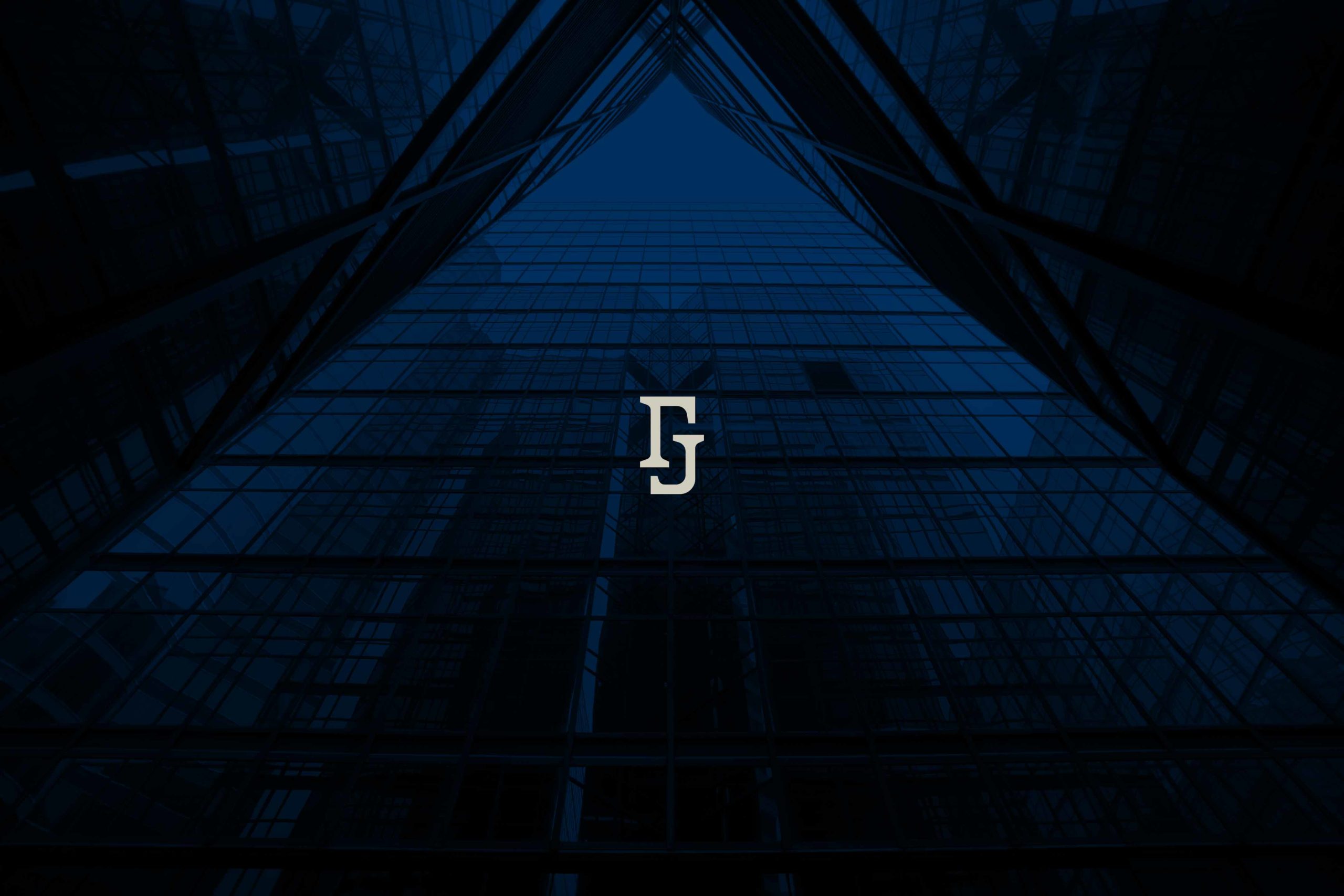 reflection-in-glass-wall-of-modern-skyscraper-JYFGPTP